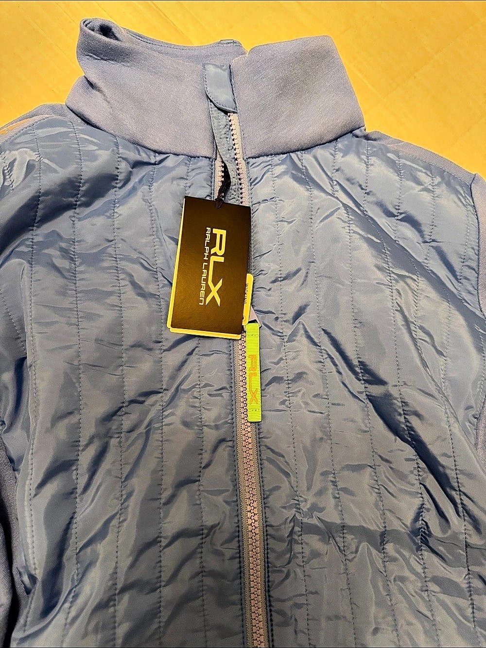 RLX woman’s Lightweight Jacket in blue NWT